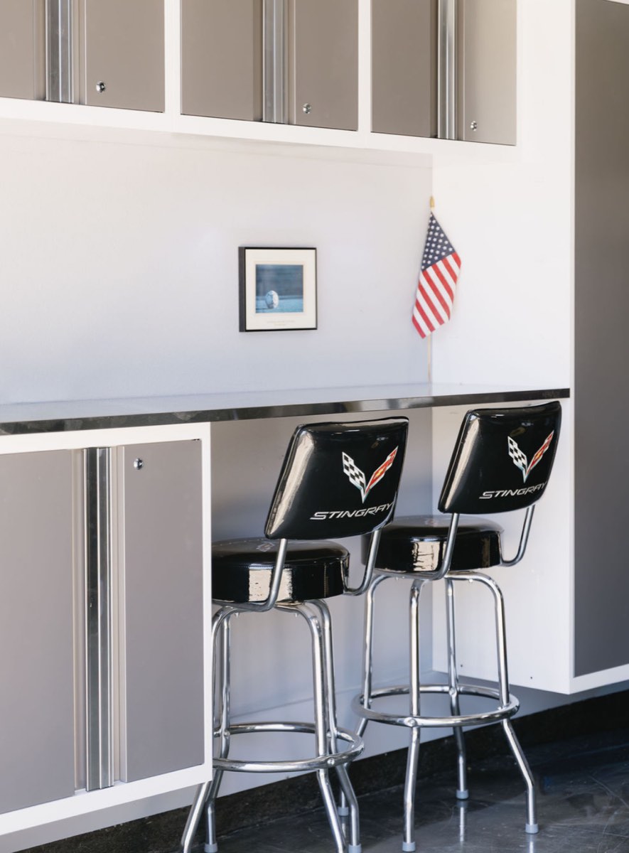 Metal garage cabinets and work counter with bar stools